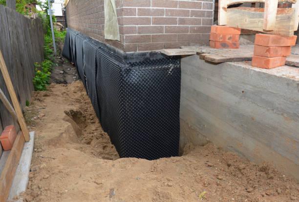 Happy homeowners after waterproofing job in Cable